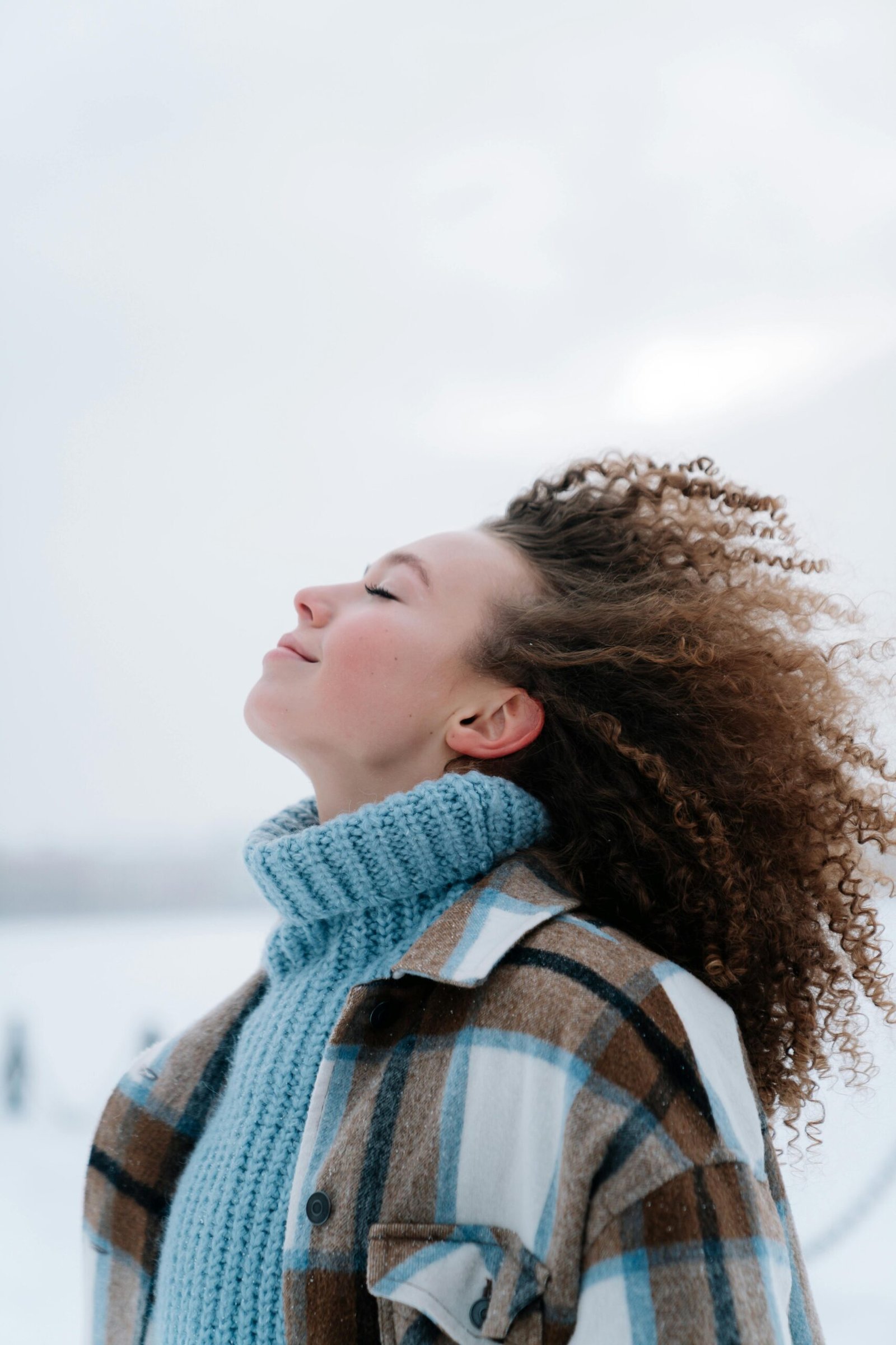 Curly Haired Woman with Eyes Closed