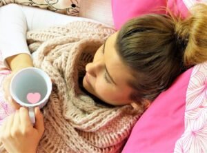 young woman, girl, lie, relax, pillow, pink, cup, heart, ill, pain, break, human, hair, female, scarf, healthy, be healthy, attention, love, alternative medicine, virus, cold, flu, vitamins, time out, quiet, depression, warm, fall, winter, at home, maintain, immune system, medicine, mother, child, family, to take care of, ill, pain, pain, pain, flu, flu, flu, flu, flu, immune system, immune system